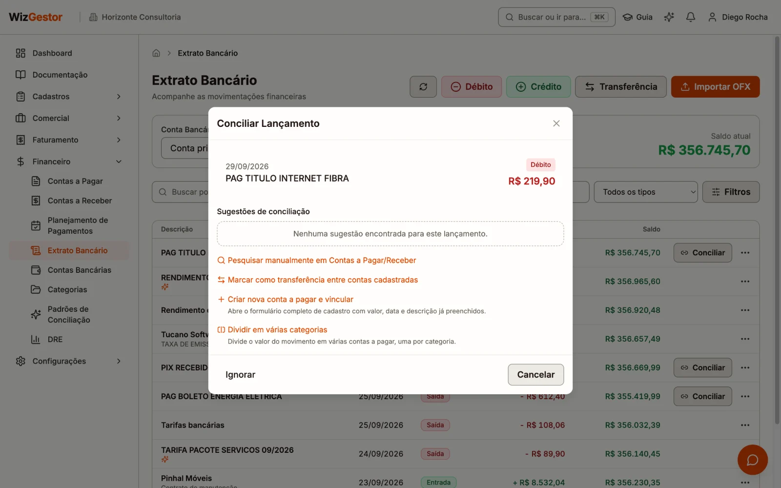 Janela de conciliação com sugestões de contas a pagar e as opções de criar, dividir ou marcar como transferência